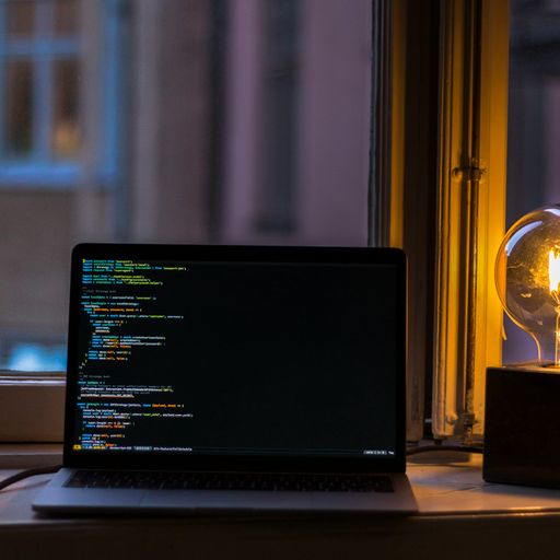 A Laptop with some random source code on the screen